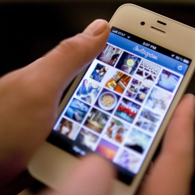 FILE - In this Monday, April 9, 2012, file photo, Instagram is demonstrated on an iPhone, in New York. Instagram, the popular photo-sharing service that Facebook bought this year, is the target of a storm of outrage on Twitter and other sites after the company announced Monday, Dec. 17, 2012 a change in its user agreement that hinted that it might use shared photos in ads. (AP Photo/Karly Domb Sadof, File)